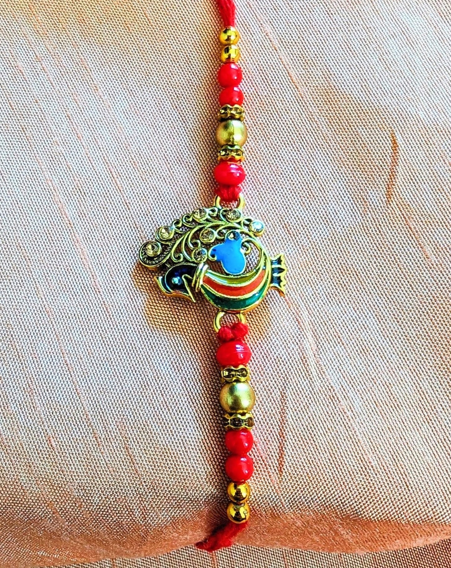 Peacock rakhi (minimal set)